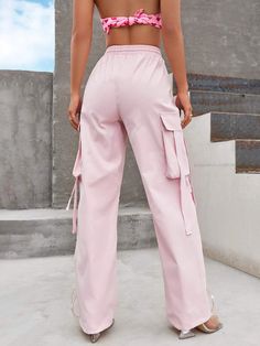 Experience ultimate comfort and a relaxed vibe with our Loose Drawstring Parachute Pant. These pants feature a loose fit and a drawstring waist, allowing you to customize the fit for optimal comfort. Made from lightweight parachute fabric, they offer a breezy and effortless feel, perfect for casual outings or lounging. Embrace a laid-back and trendy style with these versatile parachute pants. Specification: Style: Casual Pattern Type: Plain Type: Parachute Pants Closure Type: Drawstring Waist De Spring Baggy Drawstring Cargo Pants, Spring Baggy Cargo Pants With Drawstring, Pink Drawstring Trousers, Trendy Pink Drawstring Pants, Pink Wide Leg Pants With Drawstring, Spring Cargo Pants With Drawstring, Solid Color Drawstring Wide-leg Parachute Pants, Spring Cargo Pants With Drawstring And Loosely Fitted Hips, Summer Straight Parachute Pants With Drawstring