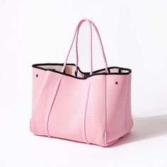 The cool, everyday bag that’s perfect for work, gym, beach, traveling, and everything in between. Everyday Bucket Beach Bag With Removable Pouch, Large Capacity Summer Shoulder Bag For Weekend, Summer Shoulder Bag With Large Capacity For Weekend, Pink Tote Beach Bag For Weekend, Pink Tote Weekender Bag, Casual Tote Gym Bag For Weekend, Pink Large Capacity Weekender Bag With Double Handle, Large Casual Bag For On-the-go, Double Handle Large Capacity Beach Bag For Everyday