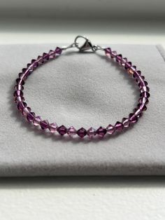 Beautiful Amethyst Swarovski/Preciosa Cyrstal Bracelet! This handmade bracelet features genuine crystals with a stainless steel lobster clasp. This bracelet is perfect for anyone who loves purple! It has a brilliant sparkle; especially in the sun or any kind of light. This specific bracelet measures at approximately 7" (see last photo) and is ready to ship. If you need a different size, just message me and I can custom make one for you! All of my bracelets are handmade with love by me! Thank you for looking and supporting my small business! Purple Shades, My Bracelets, Amethyst Purple, Handmade Bracelet, Orlando Fl, Handmade With Love, Handmade Bracelets, Are You The One, Lobster Clasp