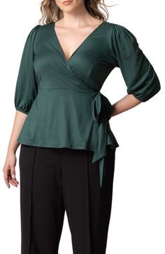 Add a graceful drape with a wrap top cut from a lightweight fabric for a look that's a breeze to style up or down. 26" length True wrap style with side tie closure Surplice V-neck Elbow-length sleeves 96% polyester, 4% spandex Machine wash, dry flat Made in the USA of imported fabric Chic Stretch Wrap Top With Surplice Neckline, Fitted Wrap Top With Surplice Neckline For Fall, Fitted Tops With Tie Waist, Chic Surplice Neckline Wrap Top For Summer, Chic Tops With Tie Waist And Surplice Neckline, Elegant Wrap Top For Fall, Elegant Surplice Neckline Tops For Summer, Chic Stretch Wrap Top For Spring, Chic Solid Surplice Neckline Tops