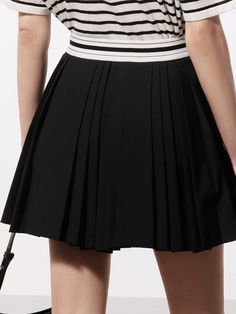 MO&Co. Women's Contrast Waist Pleated Skort This skort with a contrast waistband and pleated design is a versatile and stylish clothing item. Feature a high waist and A-line silhouette to create a flattering and feminine shape, while the elastic waistband adds comfort and flexibility. It can be paired with a blouse and heels for a more formal look, or with a t-shirt for a casual, everyday outfit. Features : - High waist A-line silhouette- Elastic waistband with inner shorts- Pleated design Code: Black Fitted Tennis Skirt With Pleated Waist, Fitted Black Tennis Skirt With Pleated Waist, Fitted Black Skort With Pleated Hem, Black Pleated Waist Tennis Skirt, Black Pleated Tennis Skirt For Summer, Fitted Black Bottoms With Pleated Hem, Black Fitted Skort With Pleated Waist, Fitted Black Skort With Pleated Waist, Black Pleated Hem Tennis Skirt For Summer