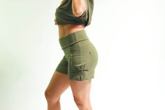 Available Colors and Sizes Black: S,M,L Sage Green: S,M,L Chocolate Brown: S,M,L 1st cousin to our best selling Yoga Cargo pants, these shorts are versatile, comfortable and flattering. The classic yoga fold down waist is combined with a drawstring for added security. These shorts can be high waisted, mid rise or hip huggers. You decide. Small cargo pockets on both sides sit just above the folded up cuffs, adding to practicality and style. Snug fitting on the waist and hips, flaring slightly int Hip Huggers, Clothes Shorts, Athleisure Shorts, Cargo Shorts Women, Boho Summer Outfits, Shorts Outfits Women, Black Tube, Boho Pants, African Print Fabric