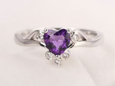 Welcome to my shop, you can find many beautiful gemstone jewelry here, and you also can ask for customized service. Main Stone: 6*6 mm heart cut natural amethyst Accent Stones: cz Metal: 925 sterling silver plated with rhodium. I also can provide metal options such as 14k solid yellow/white/rose gold Setting: prong setting More rings please go to my shop home: https://www.etsy.com/shop/XCjewelryStudio?ref=hdr_shop_menu It's a perfect gift for who born in February (birthstone),it's quite comforta Elegant Heart-shaped Amethyst Ring, Elegant Heart-shaped Amethyst Ring With Accent Stones, Elegant Amethyst Heart Promise Ring, Elegant Amethyst Heart-shaped Birthstone Ring, Elegant Purple Heart Promise Ring, Elegant Heart Cut Amethyst Promise Ring, Elegant Purple Heart Ring For Wedding, Elegant Purple Heart Wedding Ring, Amethyst Tiara