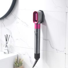 PRICES MAY VARY. ORGANIZE YOUR HAIR TOOLS: Keep your Dyson Airwrap Styler neatly organized with this metal wall mount holder. SAVE SPACE: Free up valuable counter space in your home, bedroom, or bathroom with this stylish and functional storage rack. EASY ACCESS: The wall mount design allows for easy access to your styling tools, eliminating the hassle of searching for misplaced accessories. DURABLE CONSTRUCTION: Made of high-quality metal, this organizer rack is sturdy and secure, ensuring your Hair Curling Wand, Styler Hair, Metal Organizer, Wall Mounted Hair Dryer, Dyson Airwrap, Accessories Organizer, Iron Accessories, Hair Dryer Holder, Curling Hair With Wand