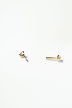 A brilliant white diamond set in 14k gold — the perfect accent to a curated ear. Our threadless flat back studs are super comfortable and make it easy to wear all day everyday. 14k solid recycled yellow gold 14k white gold post Diamonds: 2mm, 0.03ct per earring, reclaimed Flat Backing: 14k yellow gold, 1.0mm diameter (18ga) Flat Backing Length: available in either 5mm or 7mm length These backings are exclusively for WWAKE flat-back earrings, and won't work for other WWAKE earrings Minimalist Rose Gold Diamond Earrings With Single Cut, Minimalist Rose Gold Earrings With Single Diamond, Minimalist Rose Gold Diamond Earrings, Minimalist Everyday Diamond Piercings, Everyday Minimalist Diamond Piercings, Minimalist Yellow Gold Jewelry With Screw Back, Minimalist Yellow Gold Diamond Cartilage Earrings, Minimalist Yellow Gold Piercings With Prong Setting, Everyday Minimalist Gold Diamond Earrings