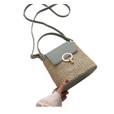 Marysol is style and beauty in all that is Spring Marysol is a sophisticated woven purse featuring a gold metal accent clasp and a crossbody adjustable strap. Its top handle is reinforced for added comfort and durability, making it perfect for pairing with a spring dress or casual jeans. This stylish and versatile bag is the perfect addition to your Spring wardrobe. We love the Mantis green color! Main Material: Faux (Vegan) Leather Lining Material: Polyester Hardware: Aluminum Alloy Number of H Modern Bags With Gold-tone Hardware For Summer, Chic Top Handle Straw Bag, Trendy Summer Crossbody Shoulder Bag, Spring Travel Crossbody Straw Bag, Chic Gold-tone Bucket Straw Bag, Elegant Woven Crossbody Bucket Bag, Chic Straw Bucket Bag With Gold-tone Hardware, Chic Bucket Straw Bag With Gold-tone Hardware, Everyday Straw Bucket Bag With Gold-tone Hardware