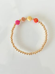 This listing is for one custom 18k gold filled beaded stretch bracelet. The 4mm 18k gold filled beads are high quality and will not tarnish. Each bracelet can be customized with a name, word, initial, or date. When you order this bracelet, put your name in the tex box (special instructions) at the checkout page. Cute Gold Stretch Bracelet With Letter Beads, Cute Gold Charm Bracelet With Letter Beads, Cute Gold Bracelet With Letter Beads, Cute Gold Bracelets With Letter Beads, Cute Personalized Gold Stretch Bracelet, Personalized Cute Gold Beaded Bracelets, Cute Gold Charm Bracelet With Round Beads, Cute Gold Name Bracelet For Friendship, Cute Gold Beaded Stretch Bracelet