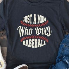 Celebrate your love for baseball and family with this "Just A Mom Who Loves Baseball" tee! THE FIT True-to-fit. If you prefer a looser fit, we recommend ordering one size larger than normal. SPECS Printed on Bella Canvas shirts in Vintage Black - 100% airlume ringspun cotton Printed on Next Level shirts in Heather Red, Heather Midnight Navy and Warm Grey - 60/40 combed ring-spun cotton/poly CARE INSTRUCTIONS Machine wash cold, inside out, with like colors. Tumble dry low heat or lay flat to dry. Do not iron printed area. Graphic Tee With Lettering For Baseball Season, Baseball Season Sports T-shirt With Slogan, Baseball Season Sports Slogan T-shirt, Slogan T-shirt For Baseball Season, Casual Lettering T-shirt For Sports Events, Casual T-shirt With Lettering For Sports Events, Black T-shirt With Baseball Screen Print, Baseball Season Game Day Slogan T-shirt, Game Day T-shirt With Baseball Slogan