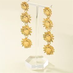 Elegant drop earrings featuring sunflowers and a goldtone finish. 0.87'' W x 3.43'' L Goldtone copper Golden Sunflower, Female Earrings, Holiday Party Gift, Earrings Bohemian, Long Dangle Earrings, Sunflower Design, Vacation Style, Floral Earrings, Party Gifts