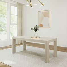 a white table sitting on top of a wooden floor