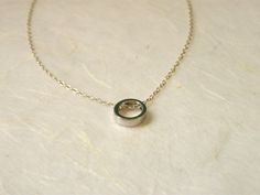 "Elegant and simple. Tiny circle charm with a delicate sterling silver chain. It is a simply beautiful piece perfect for giving to a special someone or as a gift to yourself! ♥ Circle measures 8mm ♥ Length shown on the model in the photo is 17\" Comes beautifully wrapped and ready for gift giving :) For Gold version: https://www.etsy.com/listing/264080858/delicate-circle-necklace-karma-necklace Enter Shop here: lalinne.etsy.com. Thank you so much for looking" Dainty Silver Circle Charm Necklaces, Dainty Silver Circle Charm Necklace, Silver Circle Sterling Silver Charm Necklace, Silver Circle Charm Necklace In Sterling Silver, Silver Sterling Silver Circle Charm Necklace, Simple Round Pendant Charm Necklace For Anniversary, Dainty Sterling Silver Circle Charm Necklace, Dainty Circle Charm Necklace In Sterling Silver, Minimalist Round Pendant Charm Necklace For Anniversary