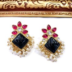 Look so elegant wearing these beautiful India kundan and pearl stud cluster earrings, with carved gemstone center in the shape of a flower bud. The ancient art of carving gemstones and setting them in jewelry is a typical style of Indian royalty. It is one way to add luster and interest to jewelry. Be noticed wearing these gorgeous earrings! Pearls add radiance and youthfulness to your complexion. Excellent quality and craftsmanship! Length 2 in Width 1 in Weight 13 gm. View more amazing earring Elegant Pearl Meenakari Earrings For Diwali, Elegant Kundan Pearl Earrings For Diwali, Gift Stone Work Pearl Drop Earrings, Traditional Jeweled Pearl Earrings For Party, Gift Pearl Drop Earrings With Stone Work, Ornate Kundan Earrings With Stone Work, Formal Temple Jewelry Pearl Drop Earrings, Traditional Jeweled Pearl Earrings For Wedding, Festive Jeweled Pearl Earrings For Wedding