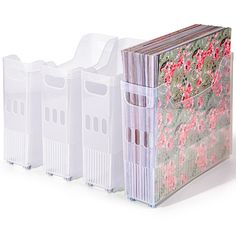 three plastic storage containers with pink flowers on them