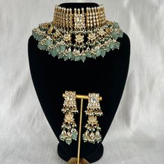 Tyaani inspired Green and Gold Indian / Pakistani Jewellery Set - Choker Necklace and Earrings. Sabyasachi inspired. PACHI KUNDAN (gold plated) We have a large inventory - message us what shade you are looking for or send picture of your outfit to match. Fast shipping - Canada & USA "Life is better ... with a Touch of Elegance". Message for any questions. Gold Bridal Necklace With Gota Work For Reception, Green Traditional Wear For Reception With Meenakari, Reception Green Traditional Wear With Meenakari, Green Chandbali Tikka For Celebration, Festive Heavy Green Tikka, Green Kundan Necklace With Gota Work For Celebration, Green Kundan Bridal Earrings With Cutdana, Elegant Green Zari Work Kundan Necklace, Bollywood Style Green Bridal Earrings For Festive Occasion