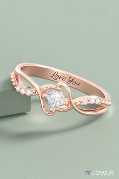 This beautiful birthstone promise ring features a customizable, princess-cut solitaire gemstone and six accent stones. Create yours in silver, yellow, white, or rose gold, and add an engraving for a special touch. This personalized promise ring makes a beautiful birthstone jewelry gift, the perfect girlfriend gift, or a romantic gift for her. #Jewlr #PromiseRing #PersonalizedJewelry #BirthstoneRing #RoseGold #Rings Asscher Cut Diamond Birthstone Ring For Anniversary, Princess Cut Diamond Ring With Accent Stones For Promise, Anniversary Rings With Princess Cut Side Stones, Anniversary Princess Cut Rings With Side Stones, Promise Princess Cut Birthstone Ring, Princess Cut Rings With Side Stones For Anniversary, Cubic Zirconia Birthstone Ring With Diamond Accents For Promise, Elegant Diamond Ring With Side Stones As Gift, Princess Cut Jewelry With Side Stones As Gift