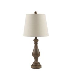 a table lamp with a white shade on it's side and a wooden base