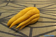 yellow fruit sitting on top of a table