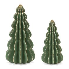 two green ceramic christmas trees sitting next to each other