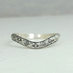 Edwardian style floral curved nesting wedding band Edwardian Wedding Band, Delicate Hand Forged Wedding Rings, Ornate Etched Wedding Jewelry, Ornate Etched Jewelry For Weddings, Classic Stackable Wedding Rings With Intricate Design, Elegant Adjustable Filigree Ring For Wedding, Classic Adjustable Filigree Ring For Wedding, Silver Filigree Wedding Ring With Decorative Band, Elegant Handmade Filigree Wedding Ring