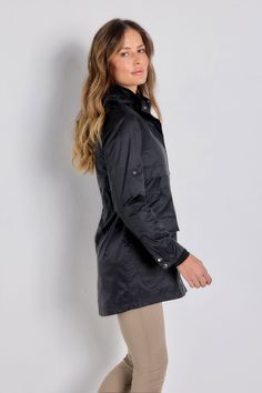 The stylish, sporty jacket that just happens to be wind-resistant, the Ramona is the one you'll want to pack for every trip. A longer-length style that weighs almost nothing and has lots of functional details like adjustable sleeve tabs and a removable hood (handy in unpredictable weather). It's the lightweight layer that everyone should have in their carry-on bag. Relaxed fit with adjustable cinched waist High collar Long sleeves with button cuffs and tabs for adjustable sleeve length Detachabl Sporty Jacket, Curvy Pants, Panel Leggings, Safari Jacket, Black Xs, Spring Dress, Cinched Waist, Spring Collection, Jersey Dress