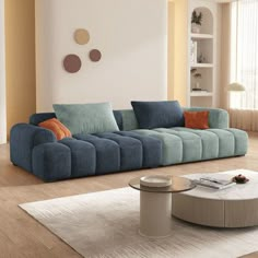 a living room filled with furniture and a white rug on top of a hard wood floor