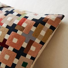 a close up of a pillow on a couch