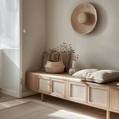 The use of light, untreated wood for the bench in this Scandinavian hallway adds warmth and texture to the space while maintaining a fresh, contemporary look Scandinavian Entryway Ideas, Hallway Aesthetic, Nordic Entrance, Scandinavian Hallway, Scandinavian Entryway, Neutral Color Palettes, Entryway Table Decor, Art Deco Boho, Entrance Table