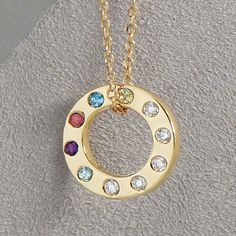 Celebrate the bonds of family with this exquisite Diamond Accented Personalized Birthstone Necklace, crafted from 14K solid gold. The elegant circle pendant can be customized with the genuine birthstones of your loved ones, making it a cherished keepsake for mothers and grandmothers. This necklace is more than just a piece of jewelry--it's a symbol of love, connection, and cherished memories. Gift it to a special woman in your life, or keep it as a beautiful reminder of your own family. ✪ DETAILS  * Offered in 14K Yellow, Rose, and White Gold (Stamped 14K for Purity Authenticity )  and 925 Sterling Silver. * Pendant Dimensions: 12 x 12 mm * Chain: 14K Yellow 1 mm Adjustable Diamond-Cut Cable 16-18" Chain * Weight : 2.53 Grams  * Stone Size: 1.5mm * Diamond Color Clarity: G-H, I1 * Customiz Gold Multi-stone Round Pendant Jewelry, Personalized 14k Gold Round Birthstone Necklace, Gold Multi-stone Necklace For Anniversary, Personalized Yellow Gold Circular Jewelry, White Gold Round Birthstone Necklace For Mother's Day, Round Sterling Silver Birthstone Necklace For Anniversary, Mother's Day White Gold Round Birthstone Necklace, Personalized Yellow Gold Round Birthstone Necklace, Personalized Round Yellow Gold Birthstone Necklace