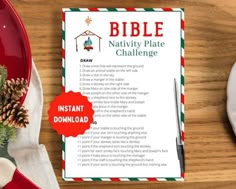 a table topped with plates and christmas decorations next to a paper that says bible nativity plate challenge