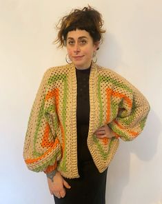 "Our lovely cosy knitwear is hand knitted by our team in the UK. Each one has its own unique colour and pattern and no two are the same.  Our knitwear is created from mixed wool using left over pieces from our other projects and follows our zero waste aesthetic. This includes wool and acrylic fibres. This beautiful sweater has cropped balloon style sleeves and squares of crochet. Oversized for that slouchy, cosy feel! We also make to order.. please contact us if you have a particular colour way in mind! MEASUREMENTS (approximate) Pit to pit unstretched laid flat 30\" Length shoulder to hem 27\" Length of sleeve from neckline 27\" CARE INSTRUCTIONS Handle as delicate cool wash Dry flat Do not tumble dry" Handmade Knit Cardigan In One Size, Handmade Knit One-size Cardigan, Handmade One-size Knit Cardigan, Spring Cozy Sweater In Acrylic Yarn, Cozy Acrylic Yarn Sweater For Spring, Multicolor Oversized Open Knit Sweater, Oversized Multicolor Open Knit Sweater, Oversized Bohemian Knitted Cardigan, Bohemian Chunky Knit Brown Sweater