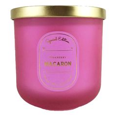 a pink candle with gold lid and label on it that says macaroni & cheese