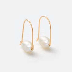 Elegant and modern, these Gold Small Floating Pearl Hoop Earrings feature a distinctive pearl drop for a fresh take on traditional hoop earrings. 1" long drop earring About 1/4" x 3/8" pearl size. Each pearl varies in size. Recycled 14k gold filled Long Drop Earrings, Pearl Hoop Earrings, Earring Sale, Drop Earring, Pearl Size, Pearl Drop, Freshwater Pearls, Gold Filled, Timeless Fashion