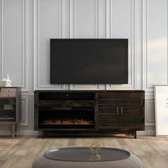 an entertainment center with a television and fireplace in the corner, next to a wall mounted flat screen tv