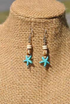 Just in time for summer, you can pick up these little beach theme earrings! I used turquoise color howlite starfish beads, bone beads and small wood beads to create the design. The eye pins and ear wires are stainless steel, making them easy to wear and care for. Need a gift idea for some one who loves the beach and tropical settings or want to add something new to your own accessory collection? Then check out these unique handmade earrings! Length from top of ear wire - appx 2.05 inches Thank you for shopping with small business! If you love these handmade starfish earrings, then check out our other creations from our home page: www.etsy.com/shops/Rocks2Gems2Wire or have something custom made just for you! PLEASE read our policy and jewelry care information below before ordering and Thank Starfish-shaped Beaded Beach Jewelry, Ocean-inspired Jewelry With Lobster Clasp For Vacation, Ocean-inspired Jewelry For Vacation With Lobster Clasp, Bohemian Ear Wire Jewelry For Beach, Bohemian Ear Wire Jewelry For The Beach, Bohemian Jewelry With Ear Wire For Beach, Adjustable Starfish Charm Jewelry, Beachy Starfish Charm Jewelry For Vacation, Bohemian Starfish Jewelry With Lobster Clasp