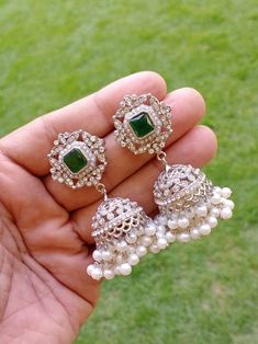 Beautiful Silver  stone Jhumkas Luxury Green Jhumkas For Diwali, Luxury Party Jhumkas With Stone Work, Elegant Jhumkas For Wedding On Eid, Elegant Jhumkas For Wedding And Eid, Elegant Wedding Jhumkas For Eid, Elegant Bridal Earrings For Wedding And Navratri, Elegant Heavy Jhumkas For Navratri, Jhumkas With Stone Work For Eid Reception, Bollywood Jhumkas For Eid Reception