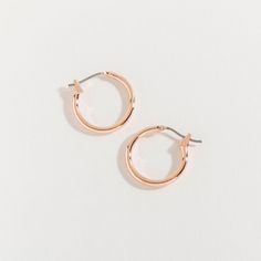 Brighten up your day with these warm and wonderful rose gold hoops. Featuring a classic shape, yet in a beautiful rose color, these hoops are the perfect twist on an otherwise timeless design. These classic hoop earrings are ideal for both professional and casual settings. And an easy click down clasp with a lightweight body will make wearing these classic hoop earrings a breeze. These beautiful hoop earrings feature a hinged back closure, keeping your earrings securely in place. Our Earrings ar