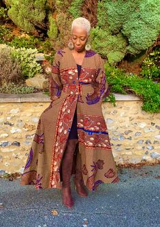 African print duster in multi-coloured hues with blue as the dominant colour. It comes with a belt in the same fabric and can be worn with or without the belt. Wrap up securely with the same fabric belt or your favourite belt or wear as a throw on or cover up. May be dressed up or down to suit the occasion. Fully lined. Handmade in Ghana. 100% cotton. HAVE YOU CHECKED YOUR MEASUREMENTS AGANST THE SIZE CHART FOR THIS SHOP? Although we do our best to make sure that the colours displayed on our Web Bohemian Printed Outerwear, Fitted Blue Bohemian Kimono, Fitted Bohemian Printed Outerwear, Fitted Multicolor Traditional Kimono, Fitted Floral Kimono For Festival, Fitted Multicolor Long Outerwear, Fitted Long Printed Kimono, Fitted Multicolor Printed Kimono, Fitted Multicolor Kimono For Festival