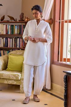 Minimal, comfortable, and chic, the Neroli Kurti is designed to bring light and warmth in the lives of all those around you. This gauze linen short kurta features gota work on the edges and can be dressed up or down depending on the occasion. White Linen Straight Kurta Set, Linen Sets With Chikankari Embroidery In Straight Kurta Style, Linen Sets With Chikankari Embroidery For Summer, Summer Linen Sets With Chikankari Embroidery, Summer Linen Set With Chikankari Embroidery, Festive White Linen Sets, Long Sleeve Linen Kurta With Chikankari Embroidery, Traditional White Linen Sets, White Linen Straight Kurta