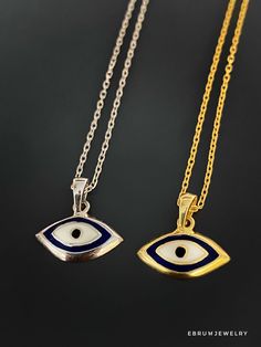 The Dainty Evil Eye Necklace is perfect for you if you're looking for something simple to wear every day. This beautiful necklace features a small evil eye charm on a sterling silver chain and will brighten your day with its protective energy and bring you good luck. This necklace comes in a silver and a 18k gold plated variant. The Dainty Evil Eye Necklace also has a matching bracelet and earrings. The Evil Eye bead is a prominent symbol in Turkish and many other cultures, and is highly protect Symbolic Necklaces With Silver Chain And Round Pendant, Symbolic Necklace With Silver Chain And Round Pendant, Symbolic Necklaces With Round Silver Pendant, Symbolic Pendant Necklace With Silver Chain, Symbolic Silver Chain Necklace With Round Pendant, Symbolic Silver Pendant Necklace, Symbolic Sterling Silver Necklace With Adjustable Chain, Symbolic Evil Eye Round Pendant Necklace, Sterling Silver Amulet Charm Necklaces With Adjustable Chain