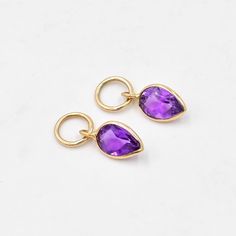 Amethyst charms for earrings (Pair) ✪Gemstone: Natural Amethyst. ✪Metal: 18k solid yellow gold. ✪Stone size: 6x4 mm. ✪Stone Shape : Pear ✪Stone Weight : 0.85 Ct. ✪Charm Weight : 0.400 Gram ✪Charm + Hoop Weight : 1.400 Gram Approx.  ✪Charm Length : 12 mm. ✪Charm width : 5 mm. ✪Bail size inside : 3.5 mm. ✪Fit Up To 3 mm Wide Hoops. ✪Hoop Size inside : 8 mm. ✪Hoop Width : 1.5 mm ✪Setting type: Bezel wire setting. If you need any other preferred stone please contact us. Amethystbenefits - *A gorgeous purple gemstone, the Amethyst is said to bring          strength, courage, and peace to the wearer.  *These benefits can help promote healing.  *It's a soothing stone with peaceful properties, with a quiet         energy that should also help release creativity. QUALITY OF MATERIALS: Metal: Most o Yellow Gold Teardrop Earrings With Charms, Bezel Wire, Hoop Charms, February Birthstone, Gold Stone, Gold Earring, February Birth Stone, Charm Gift, Solid Yellow