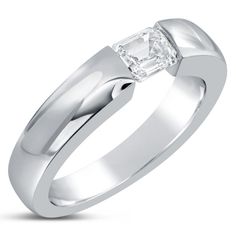 a white gold ring with a princess cut diamond