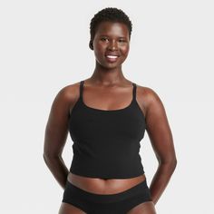 Give your everyday intimates a comfy upgrade with this Cotton Stretch Crop Cami Bralette from Auden™. This crop cami bralette is made of cotton jersey fabric with added spandex for a flexible fit that moves with you, while opaque lining provides extra coverage. The adjustable straps help you find the right fit, and unlined, wireless cups round out the design for support that maintains a natural, comfortable shape. Plus, removable padding provides a customized coverage. Auden™: Comfort true to ev Black Cotton Sports Bra With Built-in Bra, Fitted Scoop Neck Bra For Loungewear, Seamless Sports Bra With Medium Support And Tank Straps, Medium Support Camisole Tank Top With Built-in Bra, Medium Support Cami Sports Bra With Built-in Bra, Seamless Camisole Crop Top For Loungewear, Fitted Seamless Loungewear Bra, Seamless Medium Support Crop Top For Loungewear, Fitted Seamless Bra For Loungewear