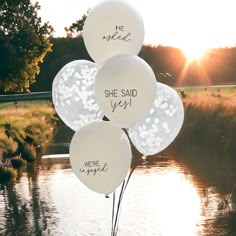 three balloons that say she said yes, we're married