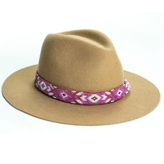 Price includes a Lola Sambboho hat & a Melrose hatband. Save 10% with this bundle. Select hat size. Hatband is one size fits all. Hatband is removable. An iconic must-have Fedora hat that will never get out of fashion. Sambboho's Lola hat has a soft brim and indented crown. A chic piece to be worn at all seasons of the year. The timelessness chic and sophistication exuded by this hat make it a lifetime wardrobe investment you’ll never regret! Classic Fedora design in Sand color Trimmed with Beaded Hat Bands, Hat Bands, Beaded Hat, Beaded Art, Seasons Of The Year, Sand Color, Hat Band, Loom Beading, Fedora Hat