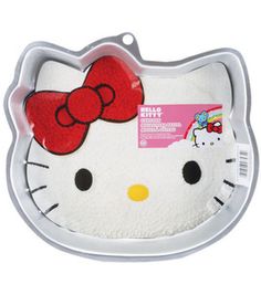 a hello kitty tray with a red bow on it