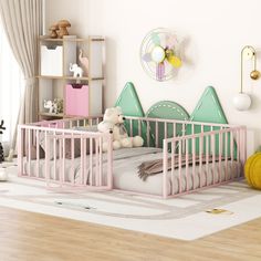 a baby's room with two cribs and toys on the floor in front of it