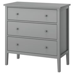 a gray dresser with three drawers and two legs