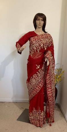 Product code-SA23 Muslin blood red designer bridal Saree for Women Fancy Party Wear.Heavy wide golden zari,Stone, karchupi hand work saree with stitched embroidered red full sleeve Blouse Falls,Picu, piping tassel work nicely done  * Saree Length: - 5.6 Meter * Blouse- stitched size 38-40  * Blouse is stitched. Saree colour-Blood red * Saree Comes with stitched Blouse piece. Red Semi-stitched Pre-draped Saree With Resham Embroidery, Red Resham Embroidery Pre-draped Saree For Wedding, Red Long Sleeve Georgette Choli, Traditional Pre-draped Saree For Navratri, Diwali Long Sleeve Sharara With Zari Work, Long Sleeve Salwar Kameez With Dori Work For Reception, Diwali Zari Work Sharara With Long Sleeves, Long Sleeve Resham Embroidery Pre-draped Saree For Festive, Long Sleeve Choli With Dabka Work For Navratri