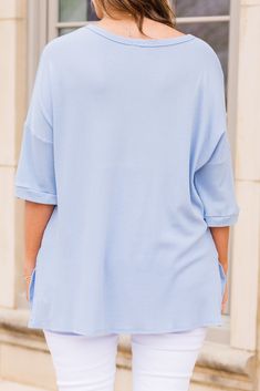 Tell a different story in this gorgeous top! This beautiful blue top is the perfect choice for a casual day out! Its comfortable fit will make you feel at ease, while its stunning color will surely make you stand out! A must-have for any wardrobe! 96% Rayon, 4% Spandex Casual Light Wash V-neck Top, Blue Cotton Blouse With Shirttail Hem, Chic Oversized Blue Blouse, Blue Relaxed Top For Loungewear, Relaxed Blue Tops For Loungewear, Relaxed Blue Top For Loungewear, Washed Blue Tops For Everyday Spring Wear, Chic Loungewear Top With Shirttail Hem, Relaxed Blue Tops With Shirttail Hem