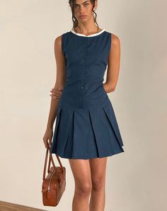 In a navy poplin, the Gitas dress features a mini, A-line design with a pleated skirt and a button up body. Boasting a boat neckline with a white broderie trim. MODEL WEARS SIZE: SMALL - MODEL HEIGHT: 5'9 Dainty Dress, Gameday Dress, Party Dress Long Sleeve, Bandeau Dress, Body Con Skirt, A Button, Boat Neckline, Maxi Dress Party, Party Dress Long